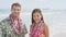 Happy Hawaii beach couple in Aloha Hawaiian shirt