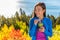 Happy healthy eating girl drinking green smoothie detox outdoors in fall autumn foliage nature retreat. Woman on weight loss diet