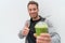Happy healthy eating smoothie juice man thumbs up. Health food person drinking weight loss sport green smoothie drink