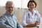 Happy healthy male senior patient looking at camera visiting physician