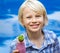 Happy, healthy school child with fresh fruit smoothie