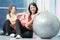 Happy healthy woman with fitness ball