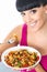 Happy Healthy Young Woman Eating a Colourful Vegetarian Pasta
