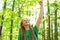 Happy hiker raising his hands in the air