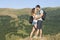 Happy hikers couple in the mountains