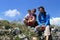 Happy hiking family on mountain top