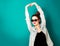 Happy Hipster Fashion Girl on Turquoise Background