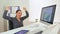 Happy Hispanic business woman excited at desk