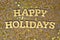 Happy holidays golden text and golden stars