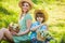 Happy holidays. Mother and cute son wear straw hats. Family farm. Lovely family outdoors nature background. Cowboy