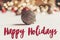 Happy holidays text, seasonal greetings card sign. glitter chris