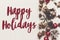 happy holidays text, seasonal greetings card sign. modern ornaments anise cones and lights on rustic white wood top view. xmas ca