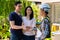 Happy homeowner stand in front of contractor and shake hand, handyman holding clipboard and after checking details before