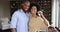 Happy homeowners African couple showing keys from their new house