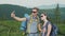 Happy Honeymoon. A young couple is photographed in the mountains, together in a hike