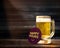 Happy Hours Promotional Concept. Glass of Beer on the Wooden Tab