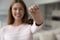 Happy house buyer woman holding keys at camera