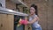 Happy housekeeper, portrait of smiling housewife female in rubber gloves during general cleaning of kitchen and