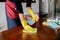 The happy housewives in rubber gloves wipe the dust with a spray while cleaning the tables and chairs cleaning concept