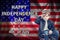 HAPPY INDEPENDENCE DAY , 4th of .July, American Boy salutes with his hand, American flag with the text Happy independence day, ba