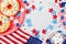 Happy Independence Day 4th july background with american flag decorated of sweet foods, stars and confetti. Holidays table.