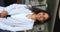 Happy Indian businesswoman posing in modern office, vertical shot