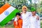 Happy Indian kids holding Indian National flag. Indian Kids celebrating Independence day or Republic day of India