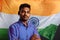 Happy indian male student with India flag posed in a proud pose