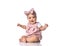 Happy infant baby toddler in polka dot dress and headband with bow sits on the floor with her arms spread wide
