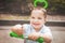 Happy infant boy on a trike