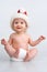 Happy infant with Christmas cap