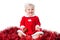 Happy infant girl wearing Santa suit isolated