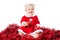 Happy infant girl wearing Santa suit isolated