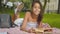 Happy intelligent little girl reading book and smiling at camera. Portrait of joyful African American child with afro