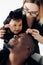 Happy interracial family with baby daughter has fun and laughs joyfully