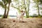 Happy Jack Russell Terrier puppy playing with a rope on the beach