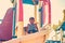 A happy and joyful boy descends on a children`s roller coaster in the park.