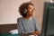 Happy joyful woman playing synthesizer at home