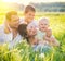 Happy joyful young family with little sons outdoors