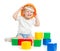 Happy kid boy in hard hat playing with colorful building blocks