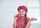 happy kid girl in cook hat and apron in kitchen, diet