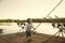 Happy kid having fun. Angling child with fishing rod on wooden pier