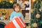 Happy kid having fun with big gift box. Christmas decorations. Wish you merry Christmas. Christmas kids. Models child