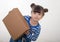 Happy kid holding cardboard boxes, delivery of goods, isolated over white. Internet purchases