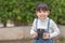 Happy kid looking ahead. Smiling child with the spyglass. Travel and adventure concept. Freedom, vacation