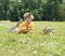 Happy kid with magnifying glass outdoors.