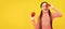 happy kid with red apple on yellow background, vitamins. Child girl portrait with apple, horizontal poster. Banner