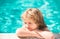 Happy kid in swimming pool. Children in tropical resort. Family beach vacation and summer activity.