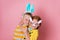 Happy kids boy and girl hug each other on Easter egg hunt. Children in Easter rabbit ears. Funny bunnies laughing with