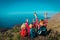 Happy kids-boy and girls- travel in mountains near sea, family in Canary islands, Spain